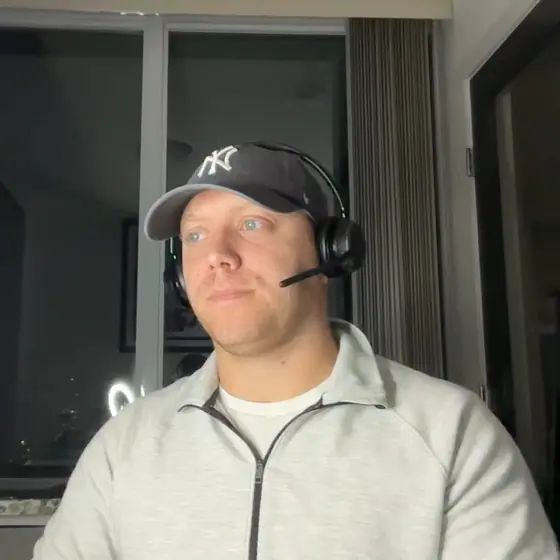 Corey Leon on a call with his headset